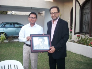 Khalid is presenting his pencil sketch to Respected Honorable Nadeem Sahib.